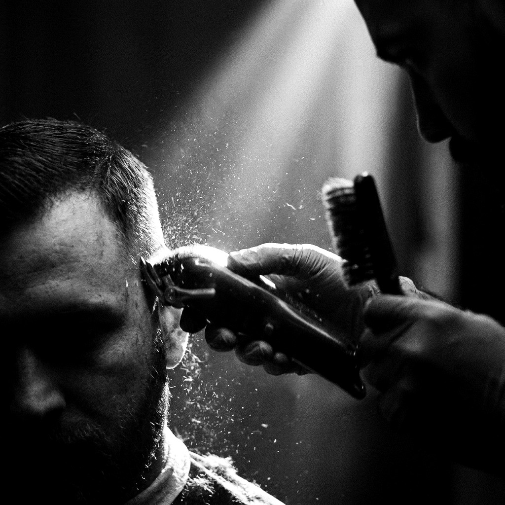 Fade House barber at work under the ring light